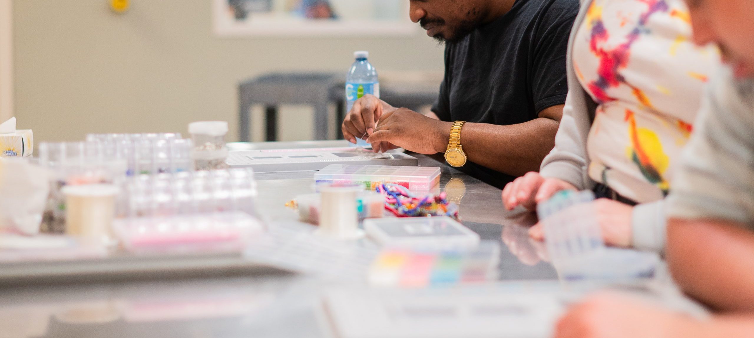 A patient doing beading work as part of a rehab program.