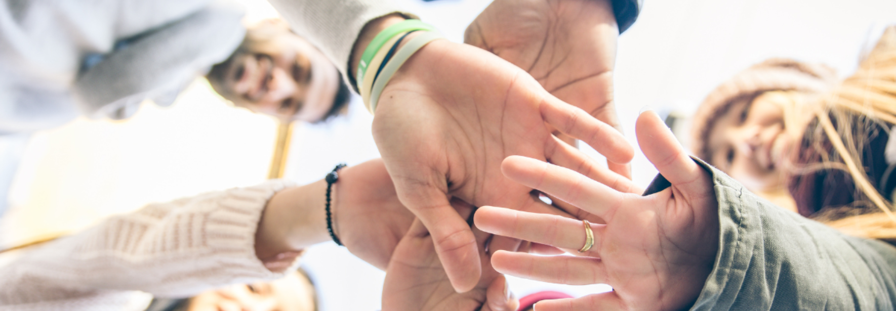 a collection of hands all in together